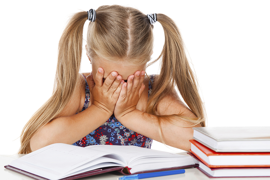 Little girl struggling with homework