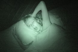 Woman screaming in bed at night